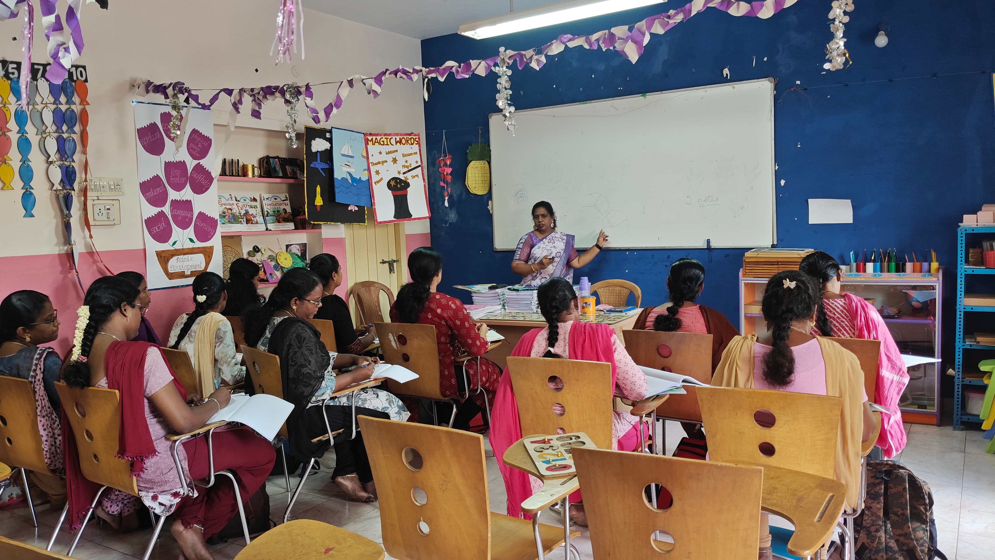 Montessori teacher training session in a colourful classroom